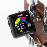 Black rechargeable tuner on guitar headstock