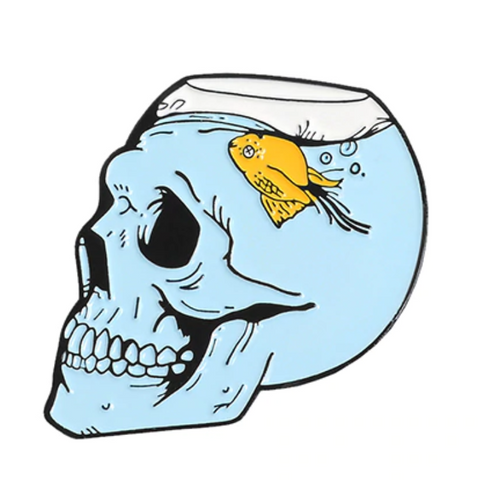 Fish tank in shape of skull with goldfish swimming upside down