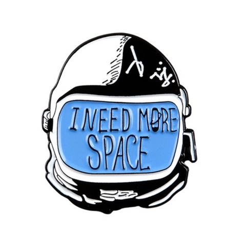 Space helmet pin with "I need more space" written on visor