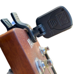 Guitar tuner with screw fastener for battery cover