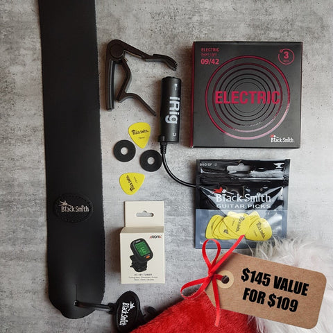 BlackSmith black leather strap, black strap locks, black capo, iRig, 3 pack 09/42 nickel wound electric guitar strings, BlackSmith yellow pick, Aroma digital chromatic tuner and Christmas stocking. $145 value for $109