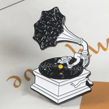 Black phonograph vinyl record player, vinyl appears like the solar system and the headshell is an astronaut