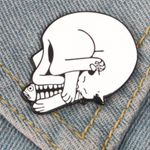 Cat fish skull pin attached to denim jacket