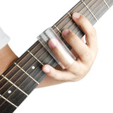 Guitarist using glass guitar slide on acoustic guitar