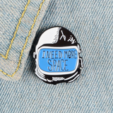 "I need more space" space helmet pin on denim jacket